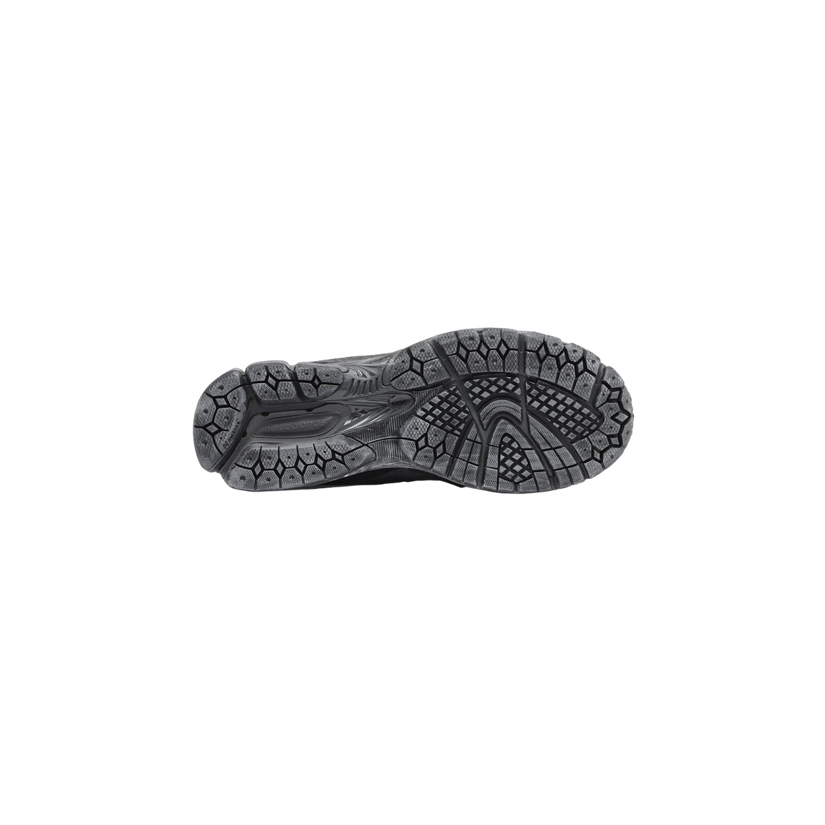 Bottom view of a gray New Balance 2002R sneaker showing a textured tread pattern outsole with the New Balance logo embossed near the arch.
