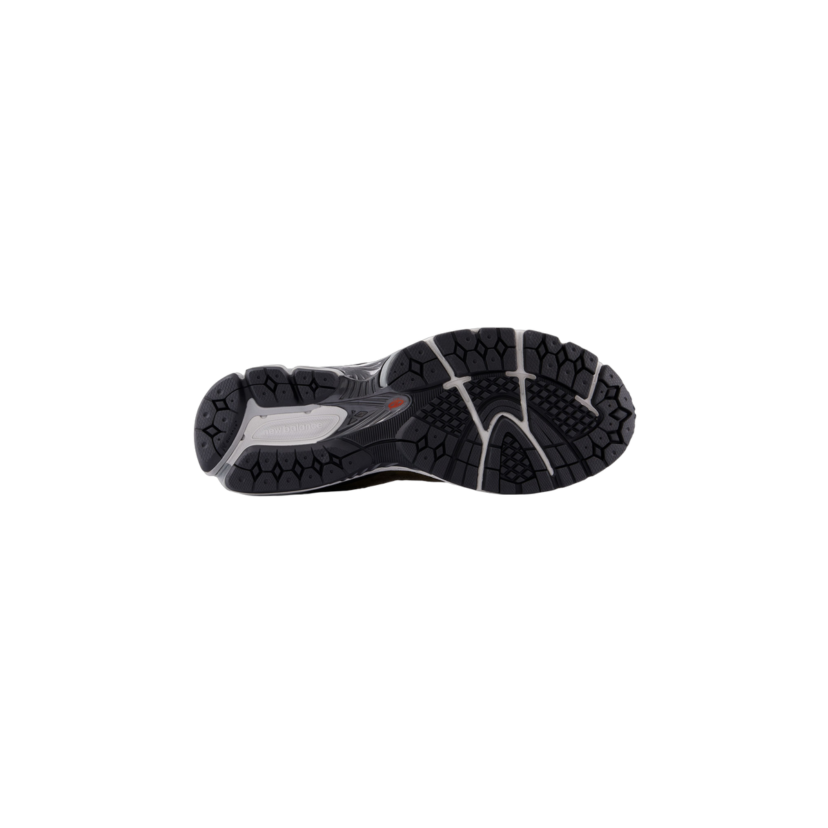 Bottom view of a New Balance 2002R sneaker showing a black rubber outsole with a deep diamond tread pattern and grey New Balance branding on the heel