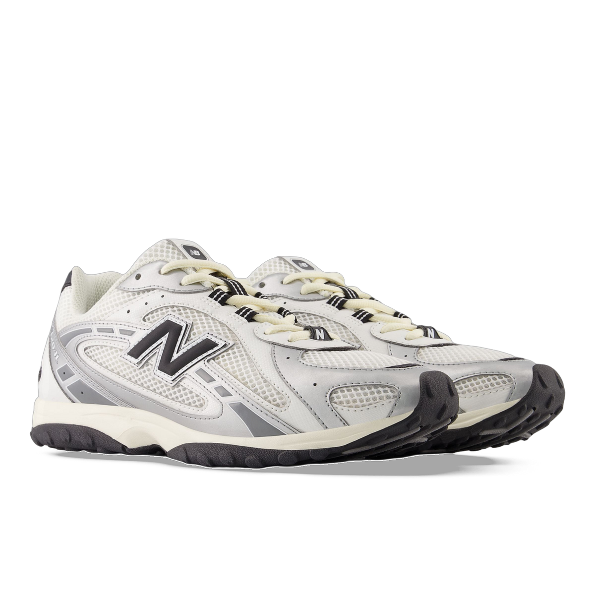 Pair of New Balance 204L sneakers in white and silver mesh with black N logo and dark rubber outsole, shown at an angle.