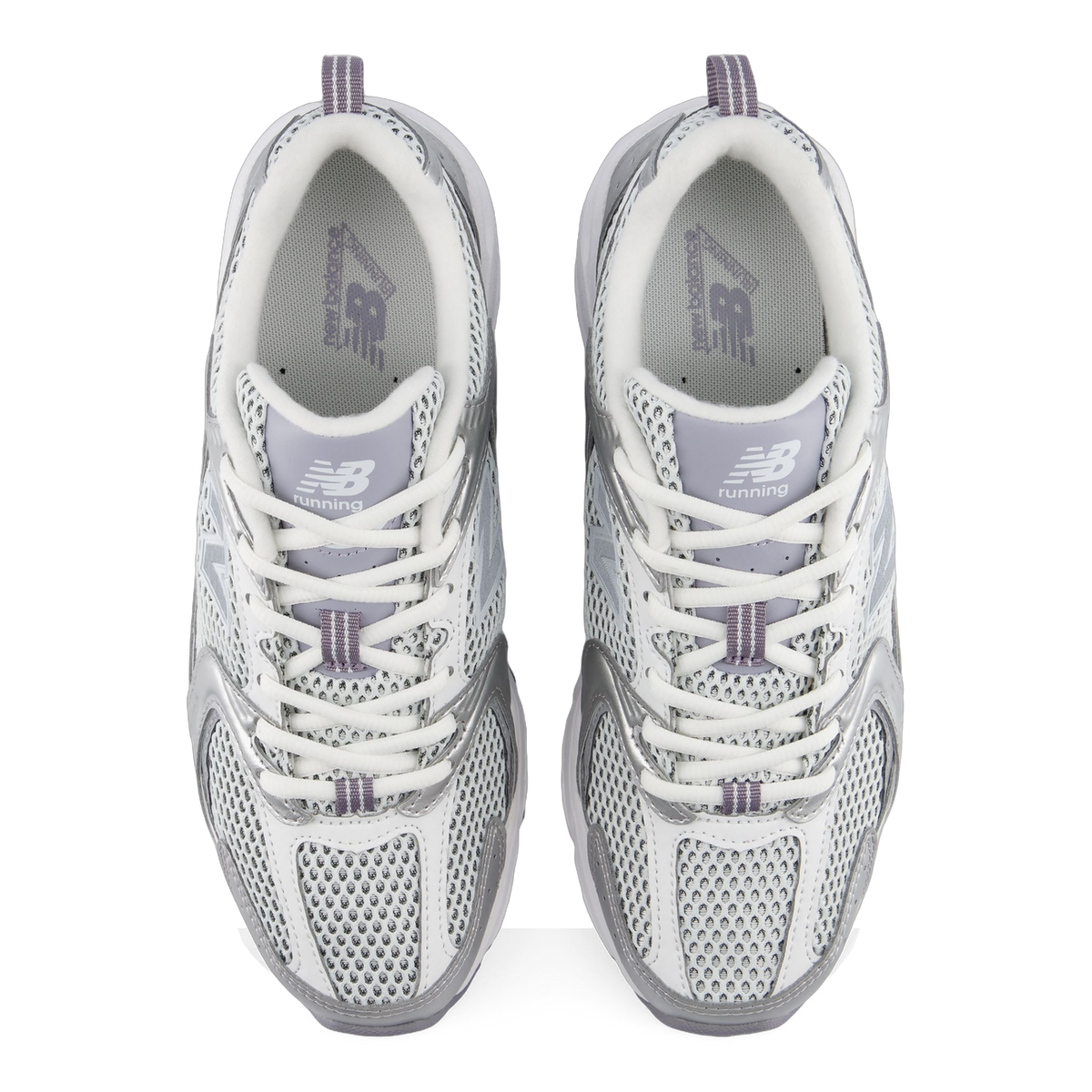 Top-down view of a pair of New Balance 530 sneakers in white and silver mesh with gray accents and New Balance running branding on the tongues