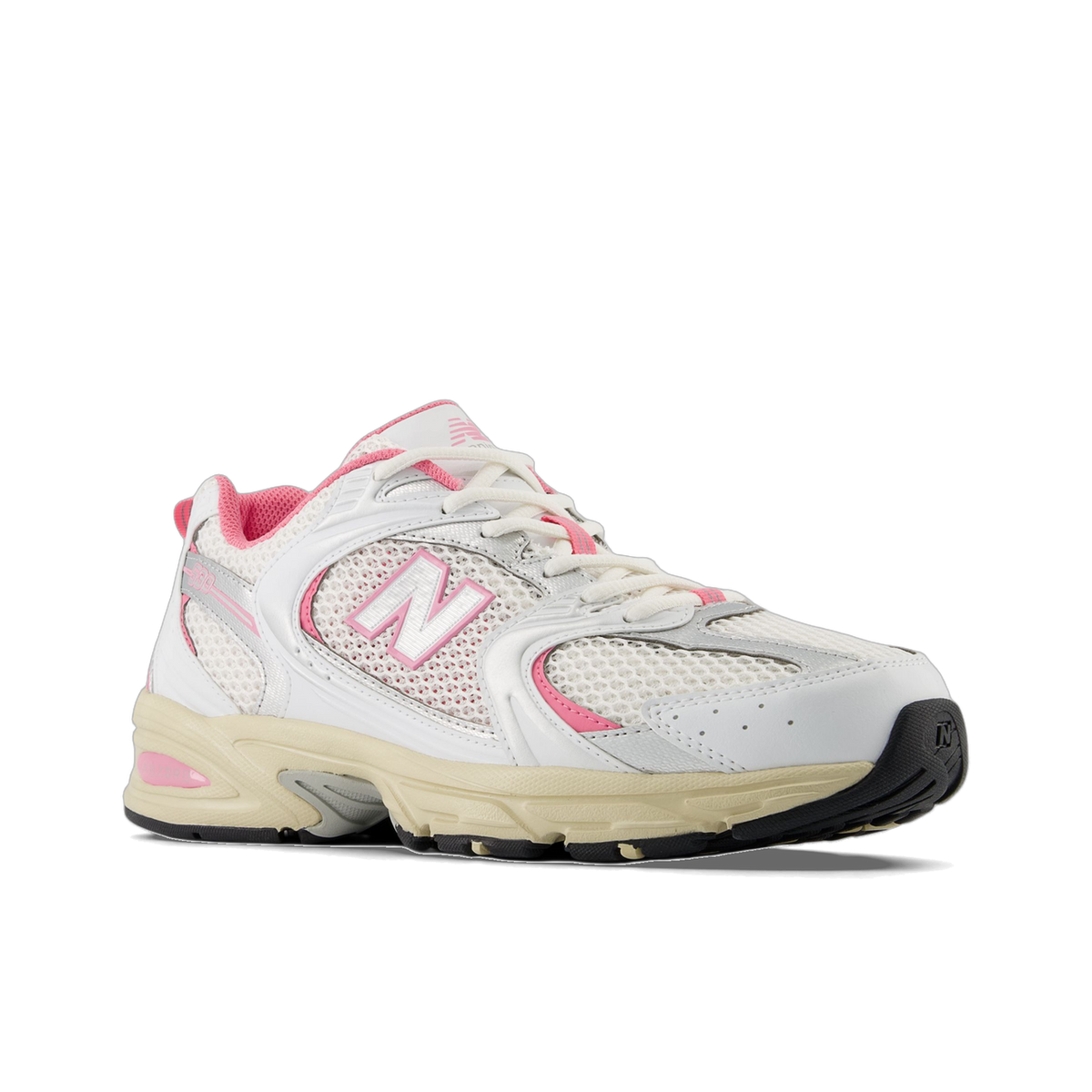 Angled side view of a white New Balance 530 sneaker with pink accents, mesh upper, and a cream midsole with silver N logo.
