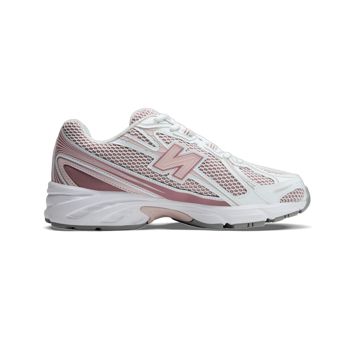 Lateral view of a white New Balance 740 sneaker with pink mesh overlays, a rose-colored N logo, and a white midsole with grey outsole, toe pointing left.