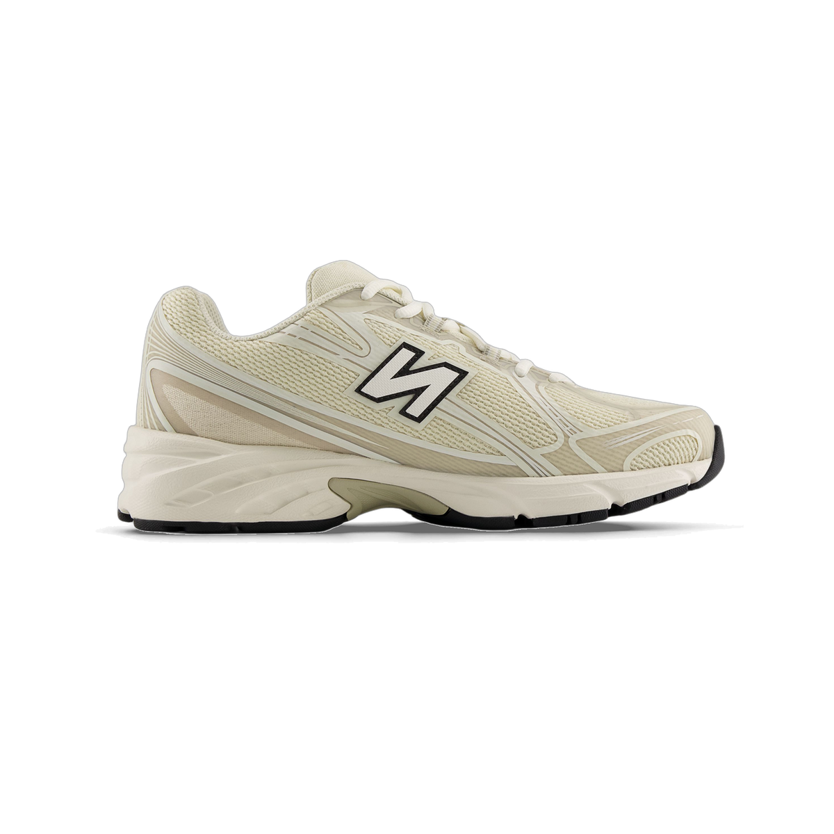 Side view of a beige New Balance 740 sneaker with a black and white N logo, toe pointing left, white midsole and black outsole