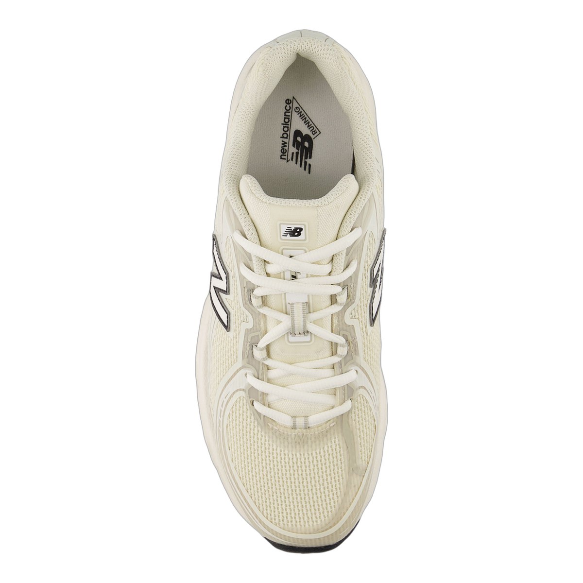 Top-down view of a cream New Balance 740 sneaker with white laces and the N logo on the side panel, toe pointing upward