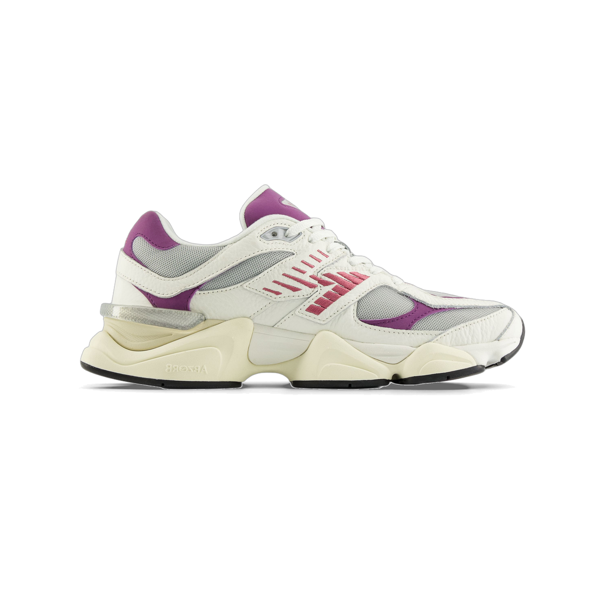Side view of a white New Balance 9060 sneaker with purple heel and panel accents, pink stitched logo stripes, grey mesh detailing, and a cream chunky midsole with ABZORB branding