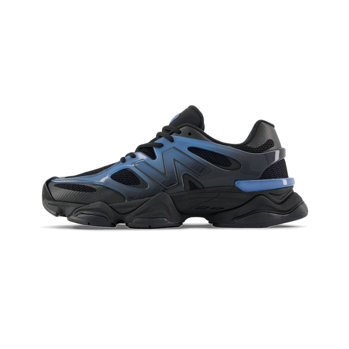 Side view of a black New Balance 9060 sneaker with a blue gradient N logo and chunky black sole, toe pointing left