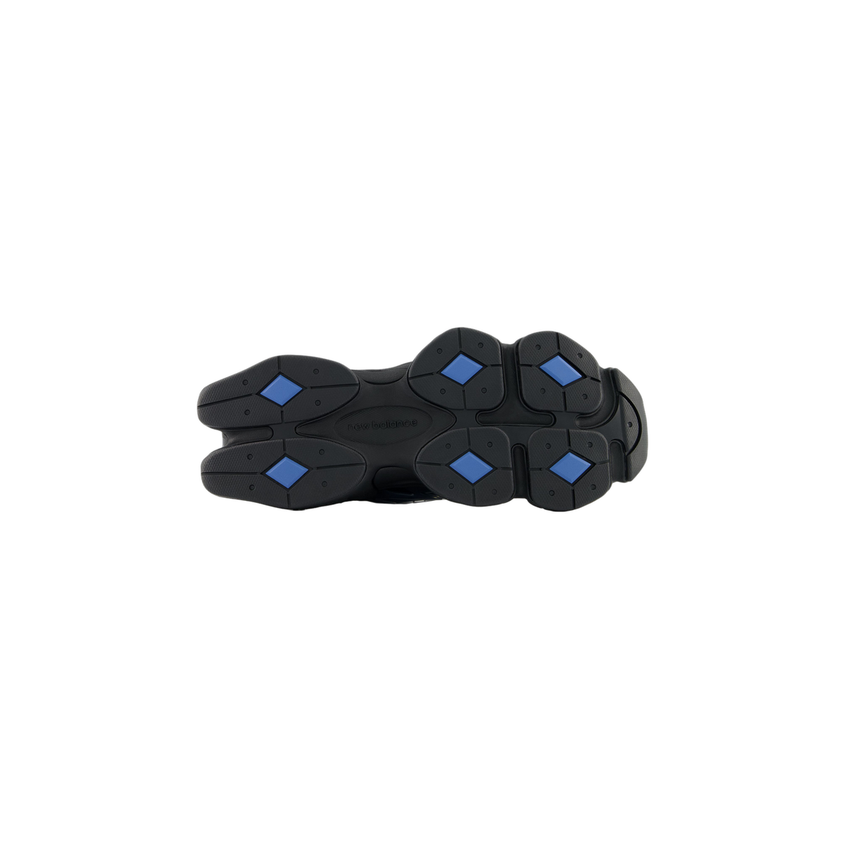 Bottom view of a black New Balance 9060 outsole with blue diamond-shaped traction pods and the New Balance logo molded into the center.