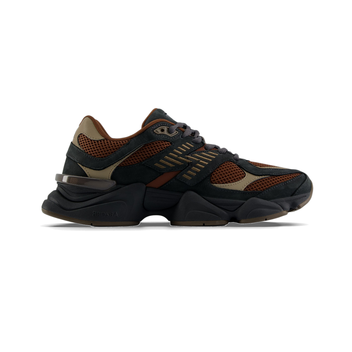 Side view of a New Balance 9060 sneaker in dark gray, rust brown, and tan with a chunky sole and visible ABZORB heel unit, toe pointing left.