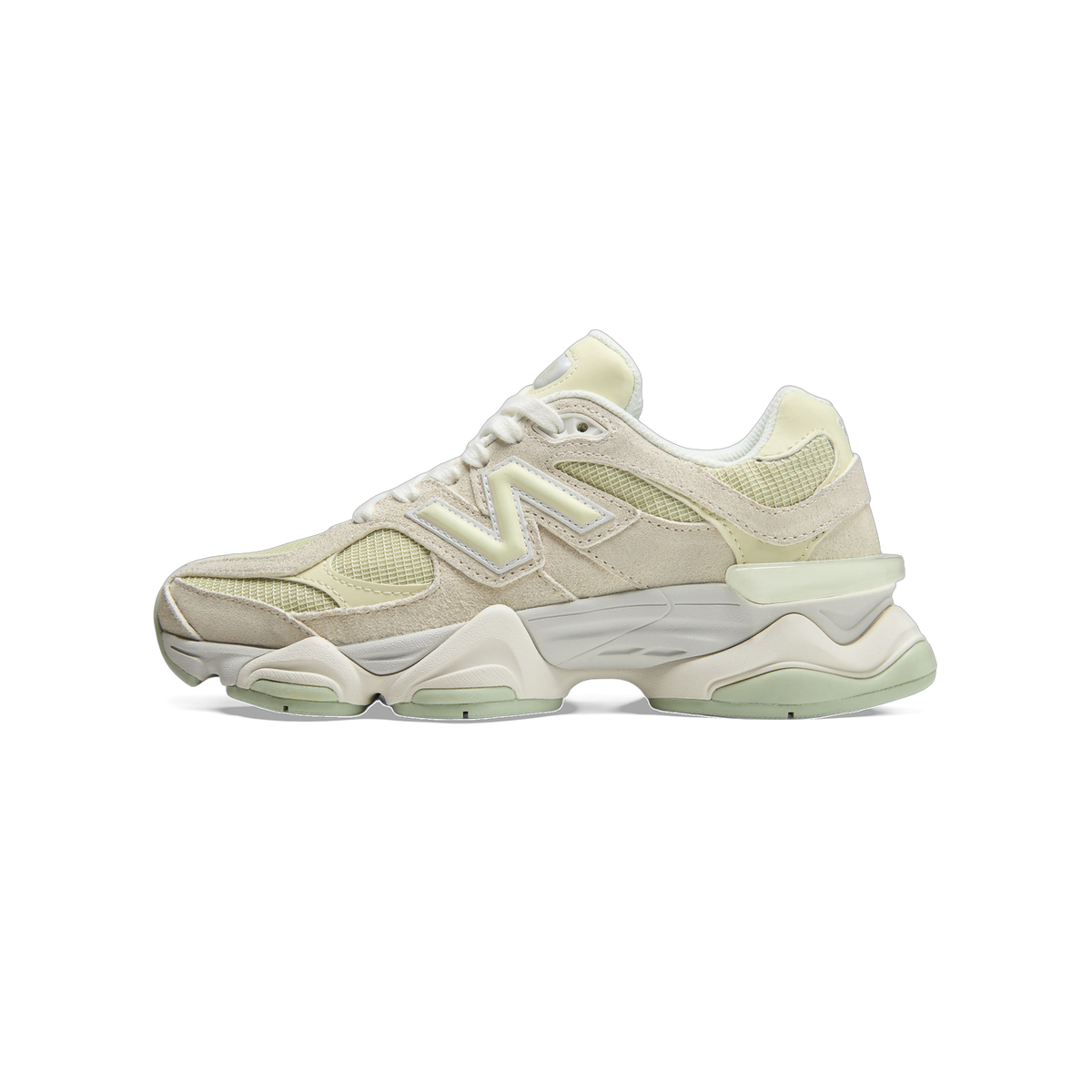 Side view of a beige and pale green New Balance 9060 sneaker with toe pointing left, showing the N logo and chunky midsole