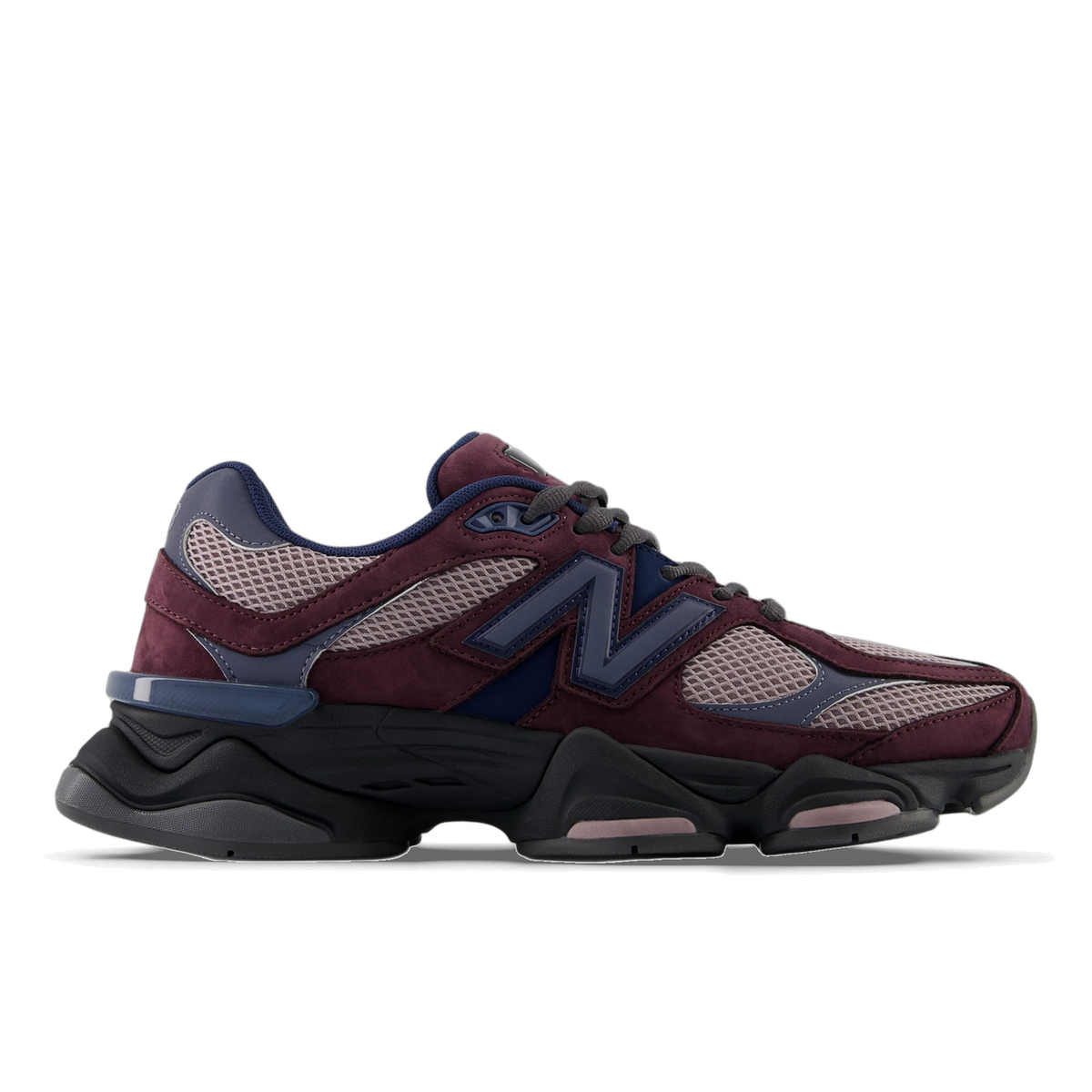 Side view of a left New Balance 9060 sneaker in burgundy and mauve mesh with navy N logo and chunky black midsole, toe pointing left