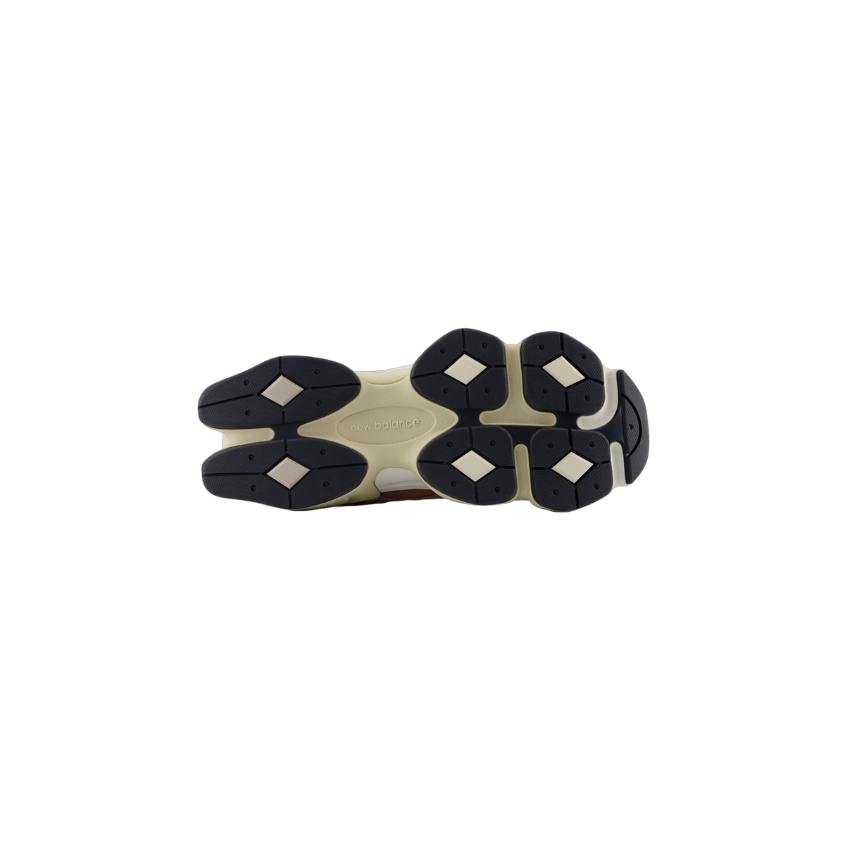 Bottom view of a New Balance 9060 sneaker showing a cream midsole and dark navy diamond-patterned outsole with the New Balance logo in the center.