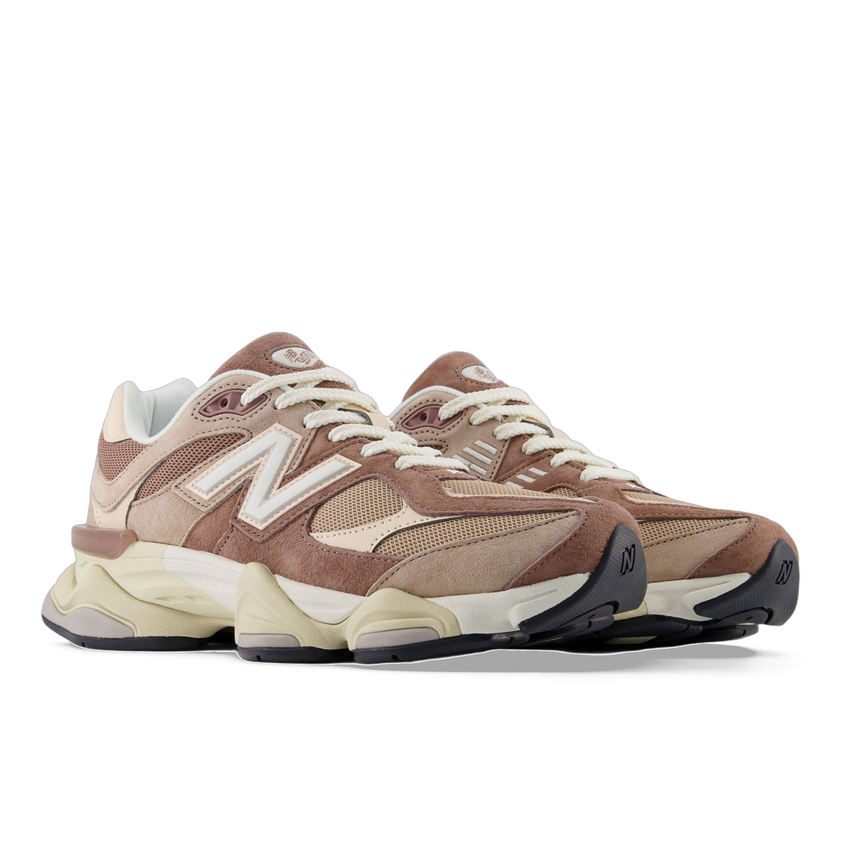 Pair of New Balance 9060 sneakers in brown and tan suede and mesh with cream chunky midsoles, shown at a three-quarter angle facing left.