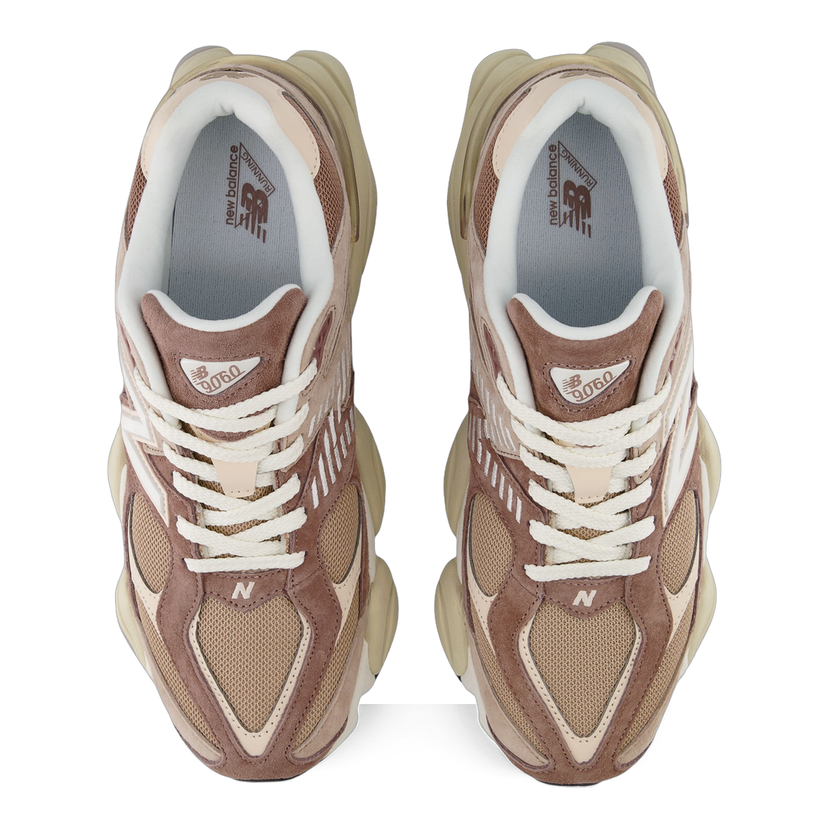 Top-down view of a pair of New Balance 9060 sneakers in brown, tan, and cream tones with white laces and 'N' logo on the toe.
