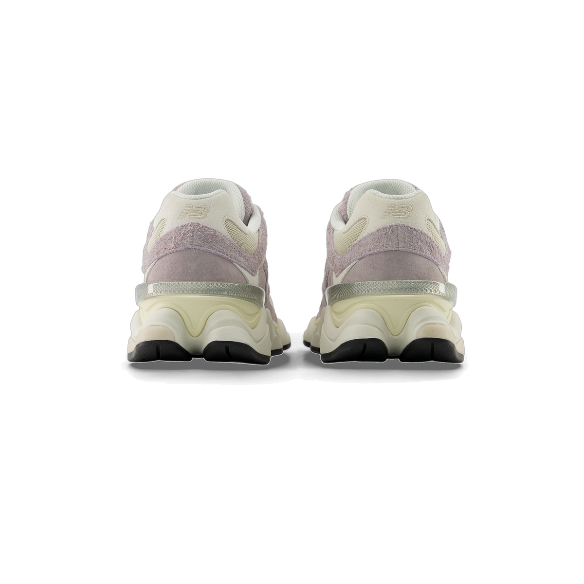 Rear view of a pair of New Balance 9060 sneakers in grey, beige, and cream with textured suede heel panels, embroidered N logos, and a chunky cream midsole with a translucent heel clip.
