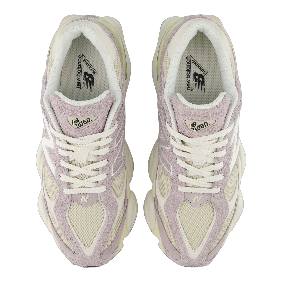 Top-down view of a pair of New Balance 9060 sneakers in lavender suede and cream mesh with white N logos and branded tongue tags.