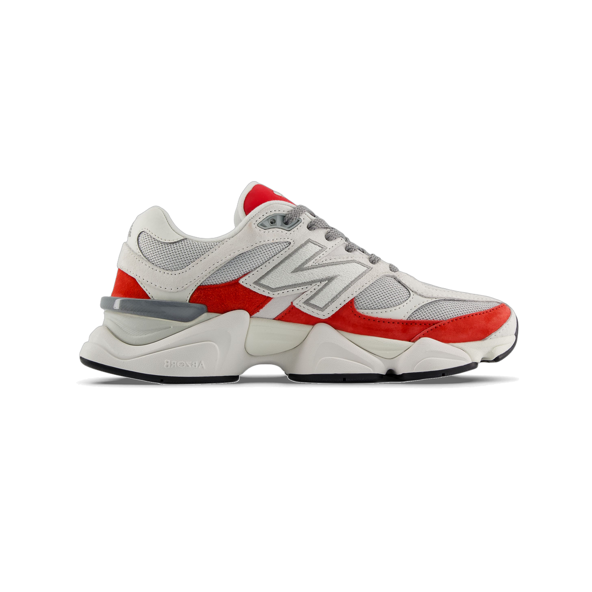 Side view of a white and red New Balance 9060 sneaker with grey mesh panels and chunky white sole, toe pointing left.