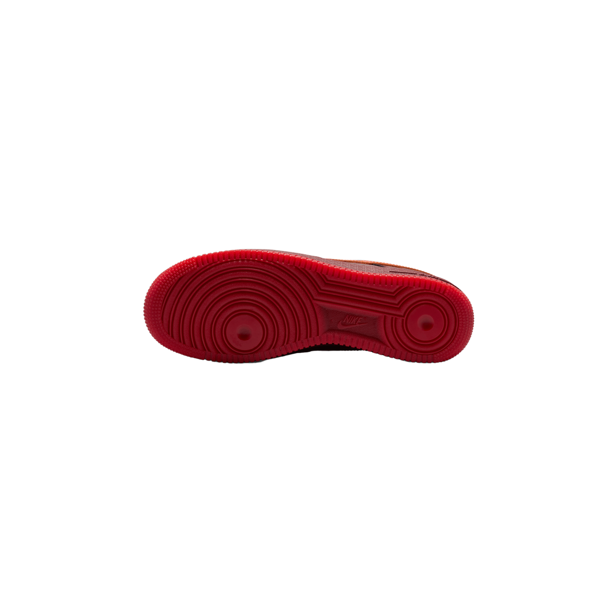 Bottom view of a single Nike Air Force 1 Low showing the red rubber outsole with circular heel and forefoot tread patterns and Nike branding near the arch