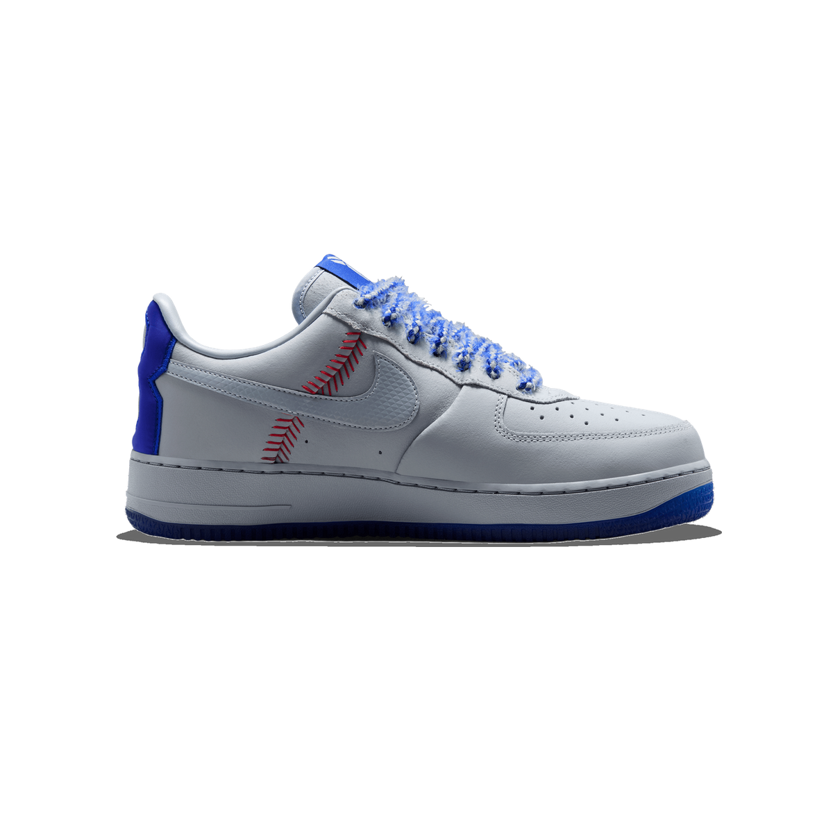 Side view of a white and grey Nike Air Force 1 Low sneaker with red baseball-stitch detailing, blue heel tab, chenille laces, and a blue outsole, toe pointing left.
