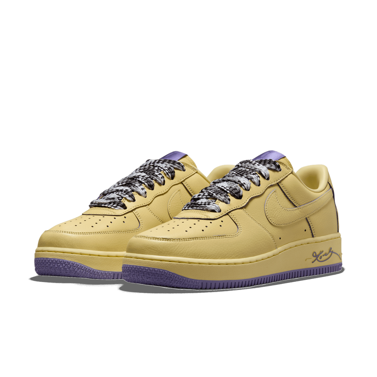 Pair of yellow Nike Air Force 1 Low sneakers with purple accents, shown side by side angled to the left, with checkered black-and-white laces and a purple heel tab.