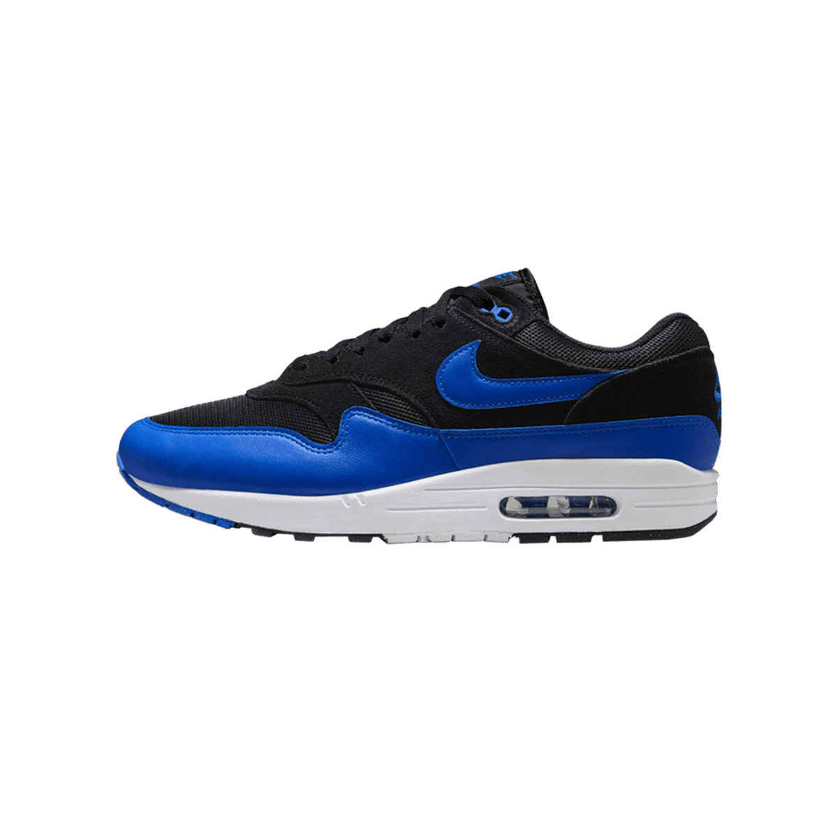 Single black and royal blue Nike Air Max 1 shoe in side profile, toe pointing left, showing the blue Swoosh on the black mesh and suede upper, blue leather overlays, and white midsole with a visible Air unit.