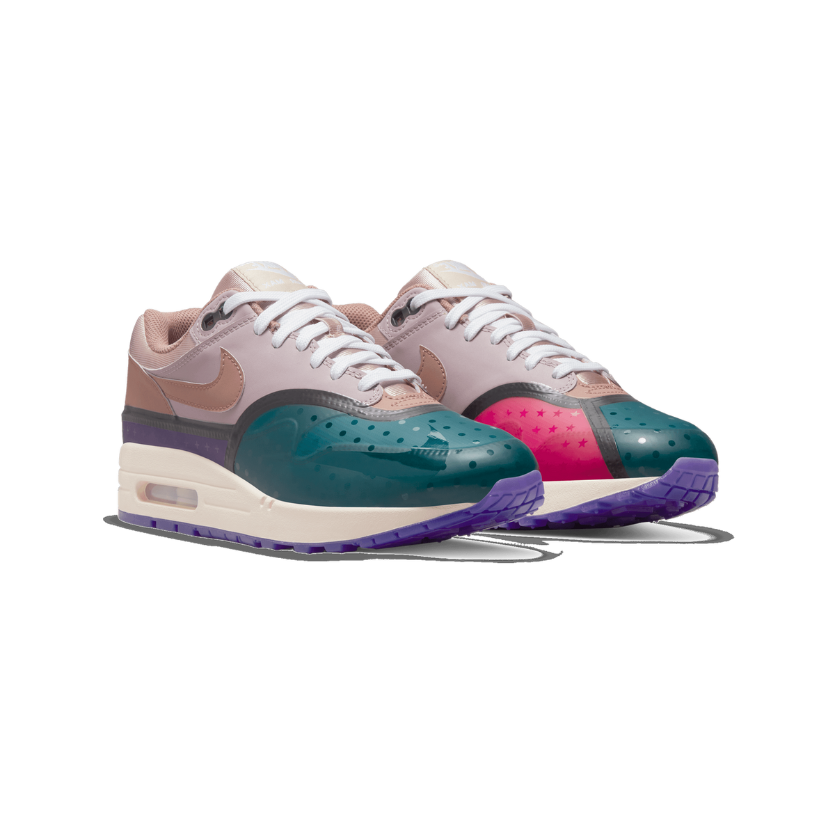 Pair of Nike Air Max 1 sneakers shown side by side angled to the left, featuring teal translucent toe caps with dot perforations, a hot pink panel with star pattern, pale mauve and rose-brown upper overlays, white laces, and a cream midsole with a vi