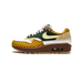 Left Nike Air Max 1 sneaker in side profile with yellow plaid toe and heel, green swoosh panel, cream swoosh, tan suede accents, and brown midsole with visible air unit.
