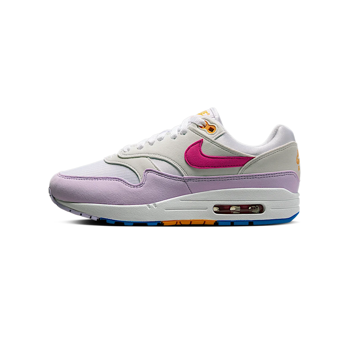 Left Nike Air Max 1 sneaker facing left, showing white and lavender panels, a pink swoosh, orange lace eyelets, and a visible Air unit with blue outsole accents