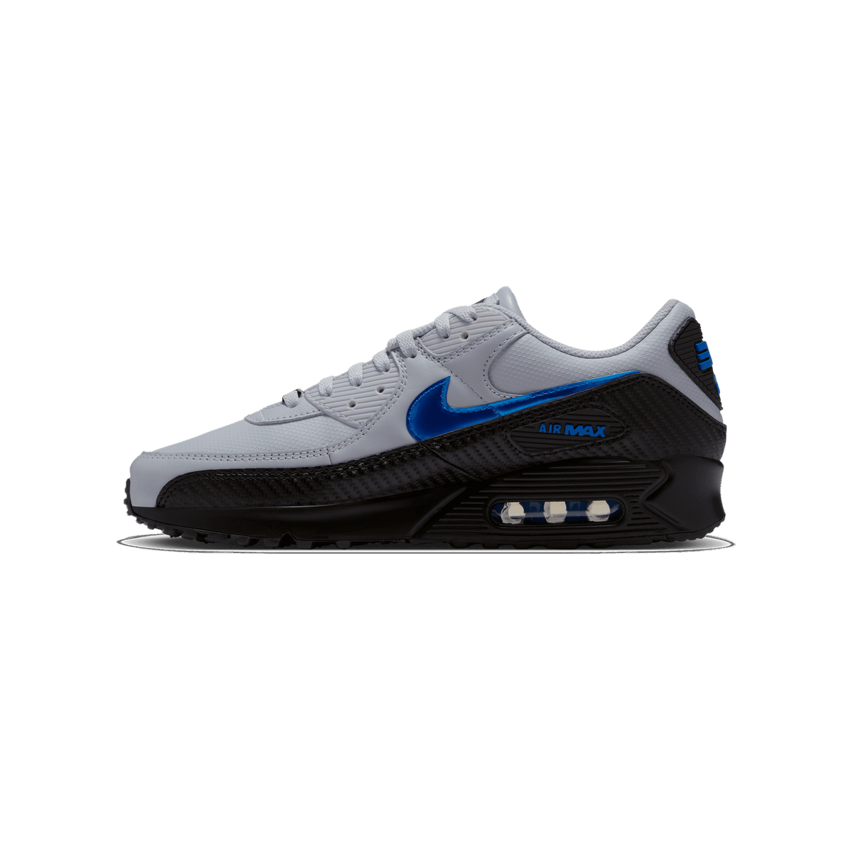 Left Nike Air Max 90 sneaker in grey, black, and blue with a carbon-fiber-textured heel and toe box, shown from the lateral side with toe pointing left.