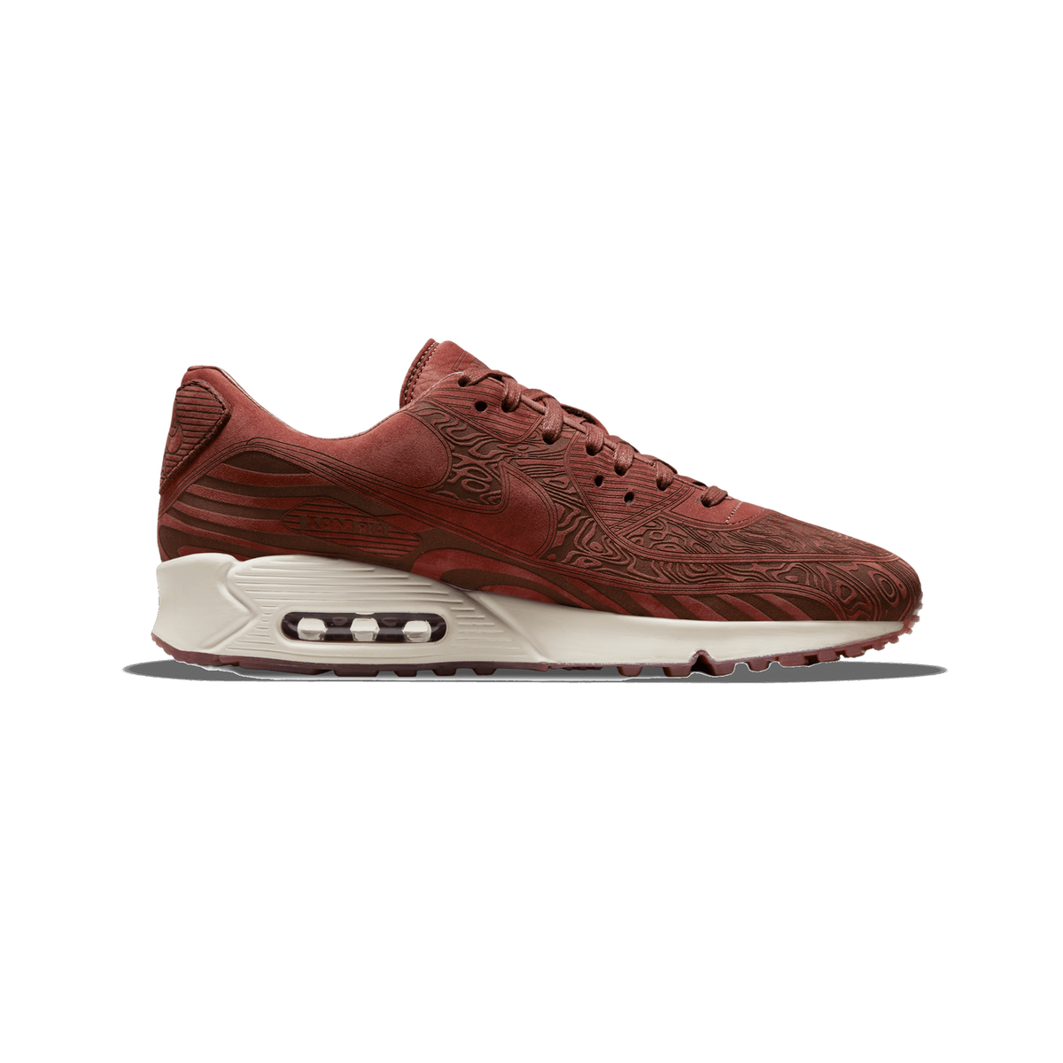 A single Nike Air Max 90 shoe in a reddish-brown laser-etched topographic pattern with a cream-colored midsole and visible Air unit, shown from the medial side with the toe pointing left.