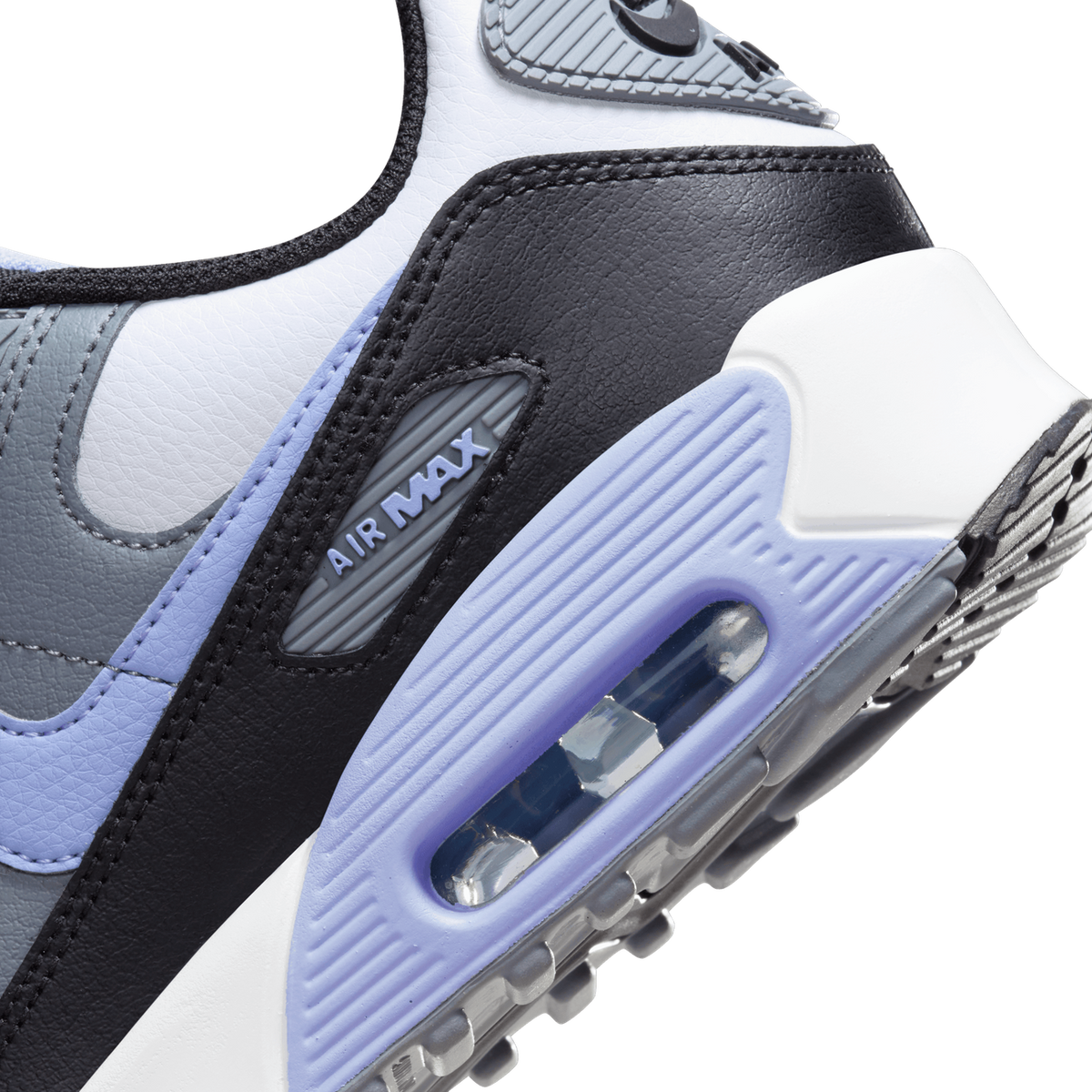 Close-up of the Air Max 90 heel showing the visible Air unit, purple and black leather panels, and 'Air Max' branded heel tab.