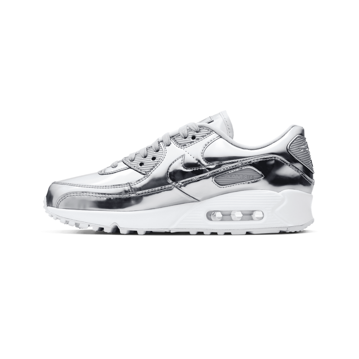 Side view of a Nike Air Max 90 sneaker in metallic silver with a white midsole and visible Air cushioning unit, toe pointing left