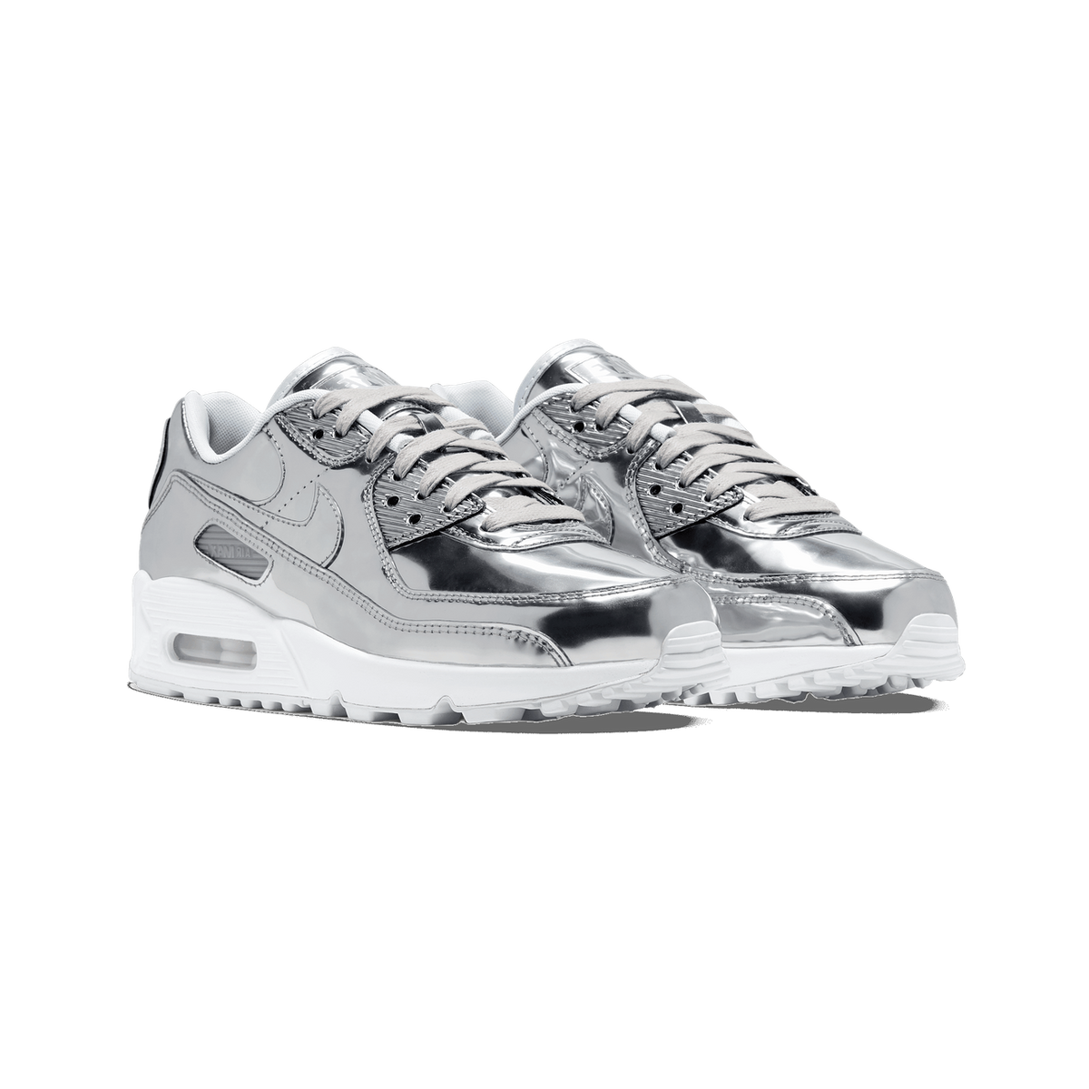 Pair of Nike Air Max 90 sneakers in a metallic silver chrome finish with white midsoles and grey laces, angled toward the left.