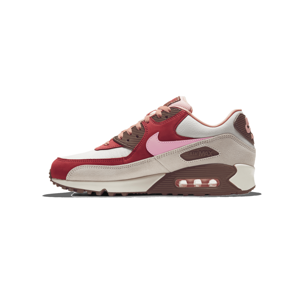 Left Nike Air Max 90 sneaker shown from the side with toe pointing left, featuring red, cream, brown and pink panels and a pink swoosh logo