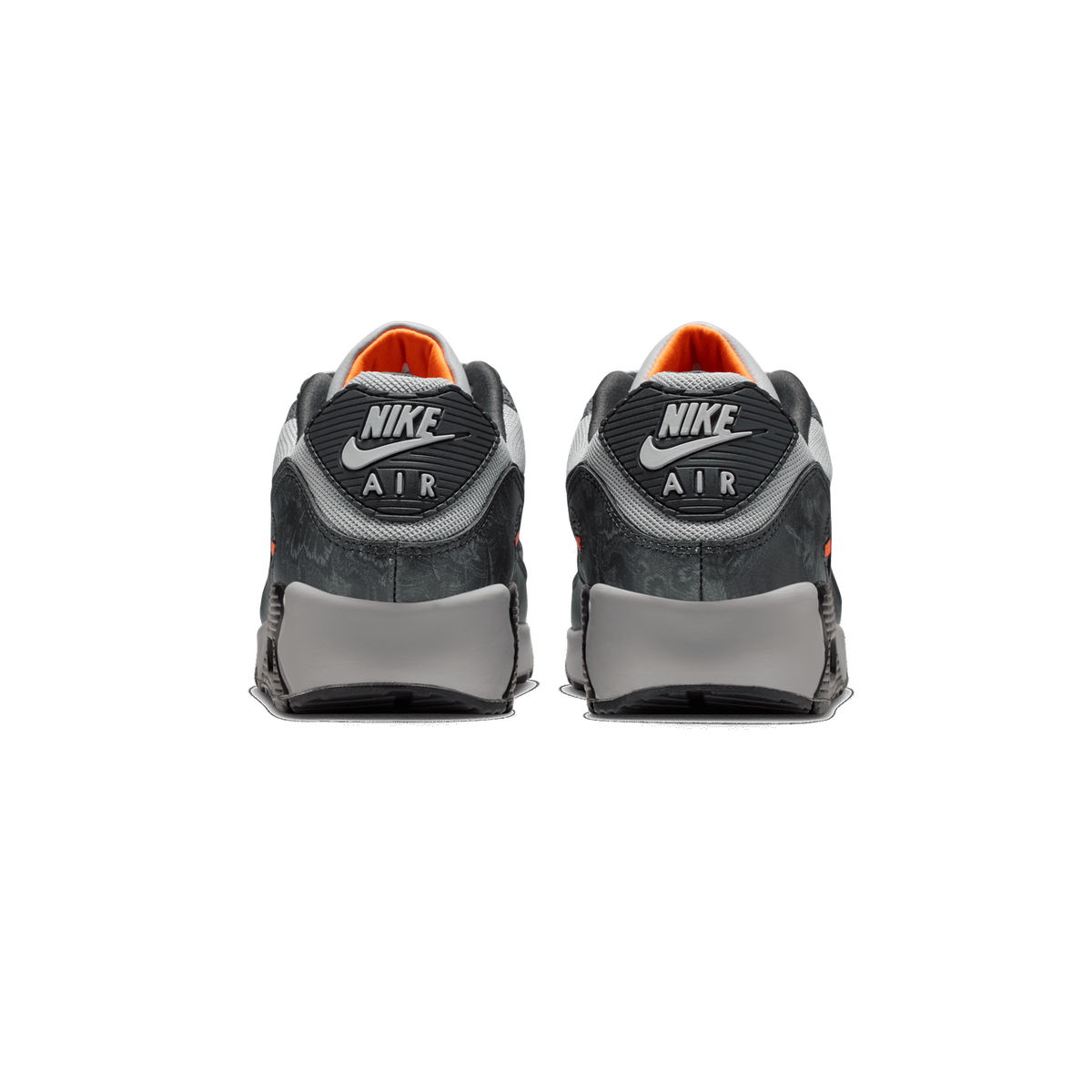 Rear view of a pair of black and grey Nike Air Max 90 sneakers with orange lining and grey Nike Air logo tabs on the heels.