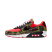 Close-up of Nike Air Max 90 'Reverse Duck Camo' sneaker, featuring bold reverse camo pattern, vibrant color accents, and signature Air cushioning, ideal for fashion-forward sneaker enthusiasts and collectors.