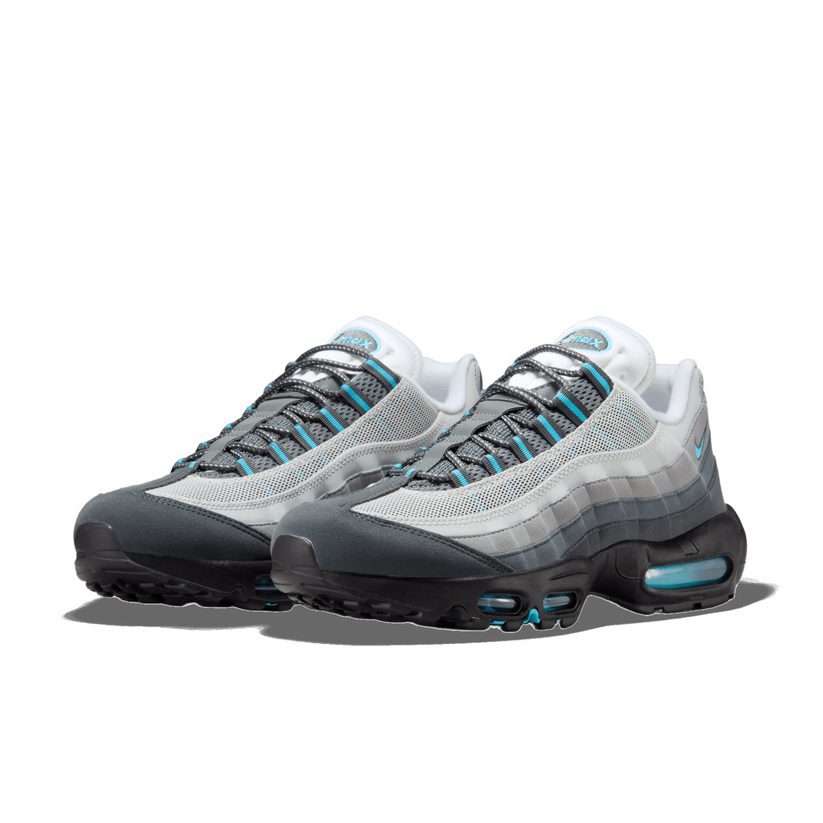 Pair of Nike Air Max 95 sneakers in grey and white with blue accents and visible air cushioning in the black heel, angled toward the left