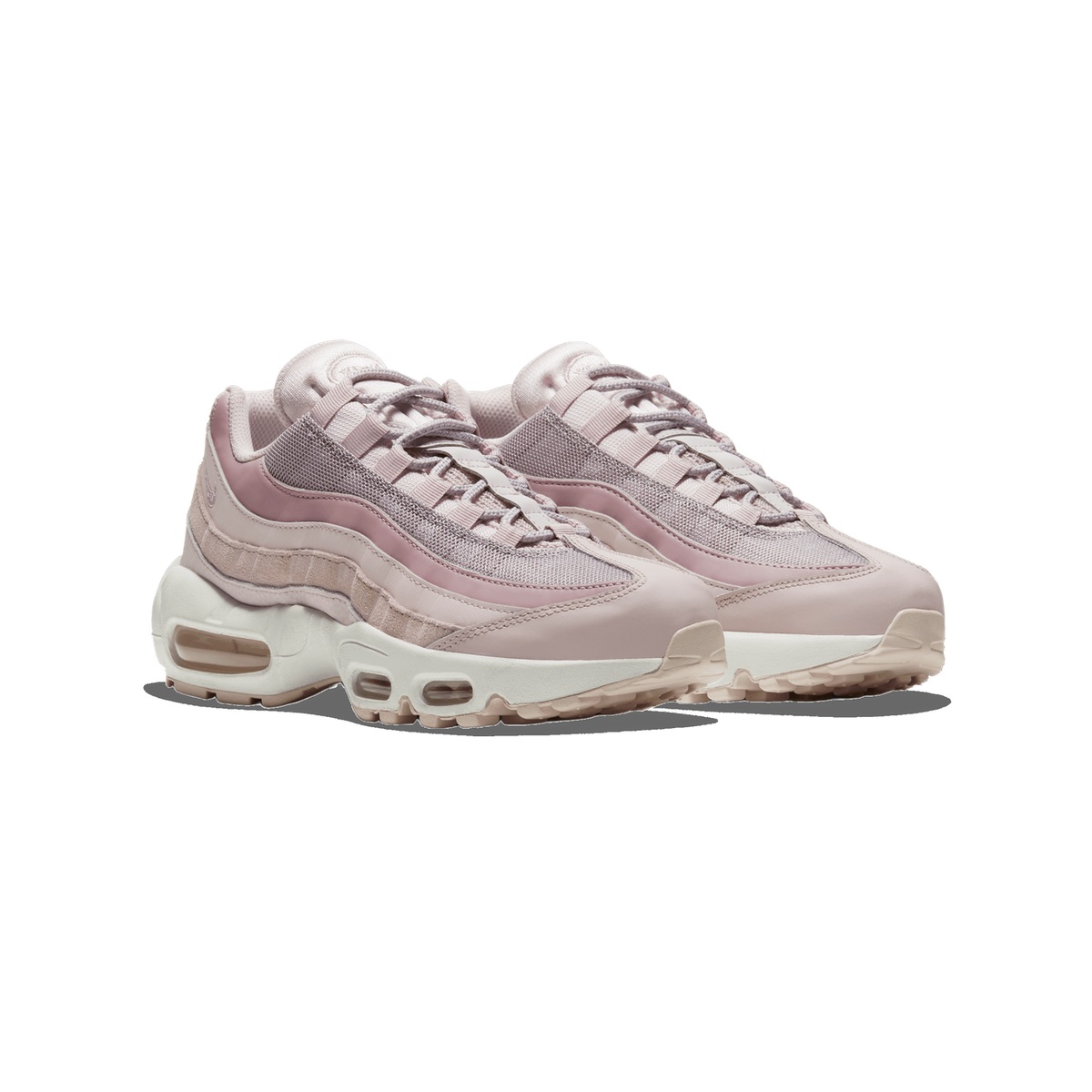 A pair of pink and off-white Nike Air Max 95 sneakers shown side by side, angled toward the left, with visible mesh panels, suede overlays, and white Air-unit midsoles.