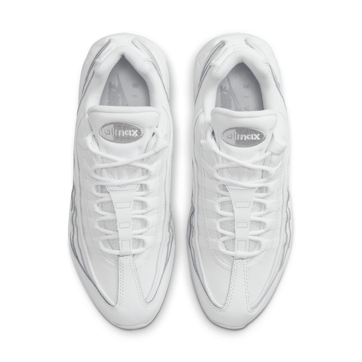 Top-down view of a pair of white Nike Air Max 95 sneakers with gray accents and an Air Max tongue logo.