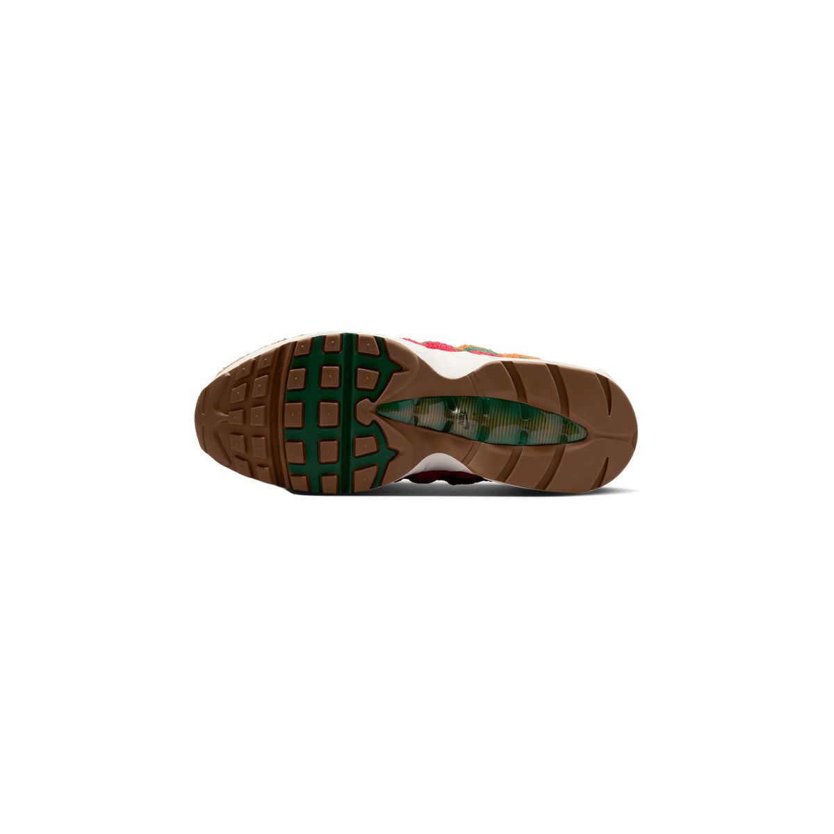 Bottom view of a Nike Air Max 95 sneaker showing a brown tread outsole with a green heel section and visible green Big Bubble Air unit with orange striping