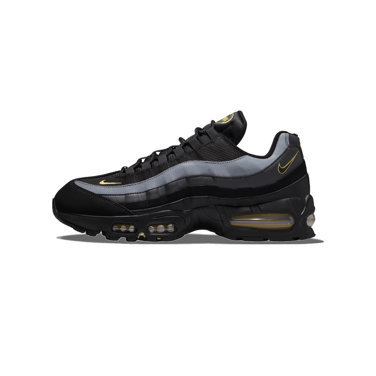Side profile of a black Nike Air Max 95 sneaker with gray overlays, black mesh upper, and yellow Swoosh logos, facing left with the toe pointing left and visible Air units in the midsole.