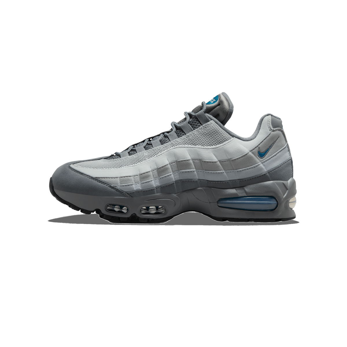 Side profile of a grey Nike Air Max 95 facing left, showing layered grey suede and mesh panels, a teal-blue Swoosh on the side, and a visible blue Air unit in the heel.