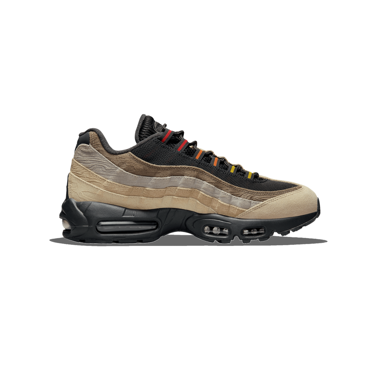 Single Nike Air Max 95 sneaker shown from the side, toe pointing left, with black mesh upper, layered beige and tan suede panels, grey textured overlays, and visible Air units in the black midsole.