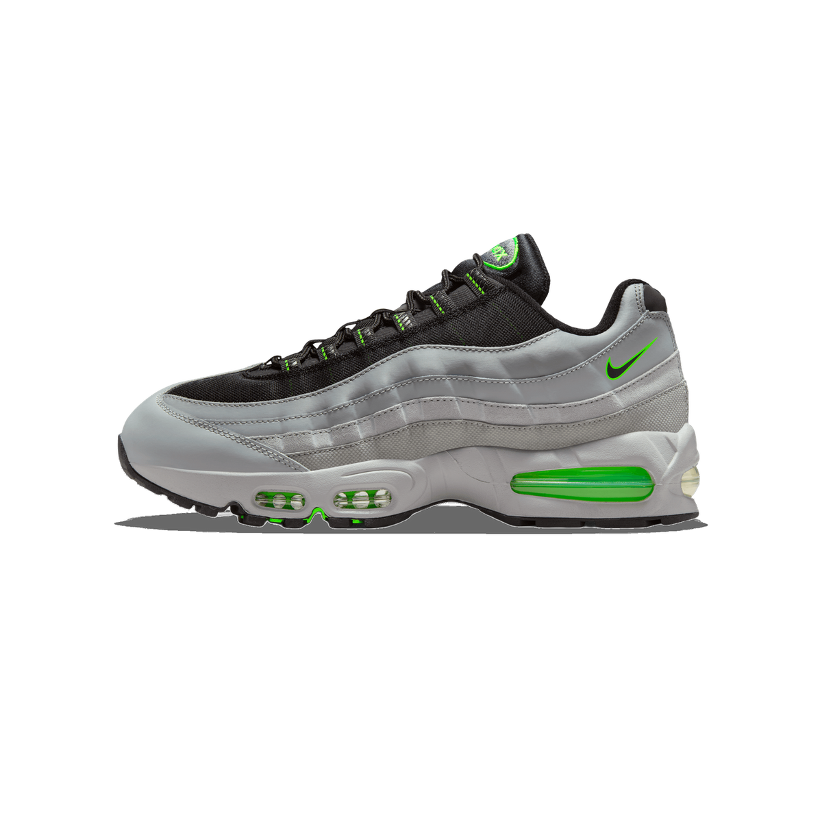Side profile of a grey, black and neon green Nike Air Max 95 sneaker with the toe pointing left, showing the green Swoosh logo on the side panel and visible green Air units in the midsole.