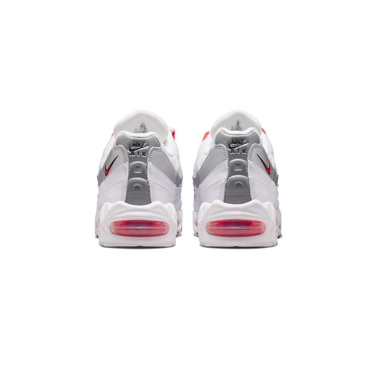 Rear view of a pair of white Nike Air Max 95 SE sneakers with silver side panels, red Nike swoosh logos, and visible red Air Max heel units.