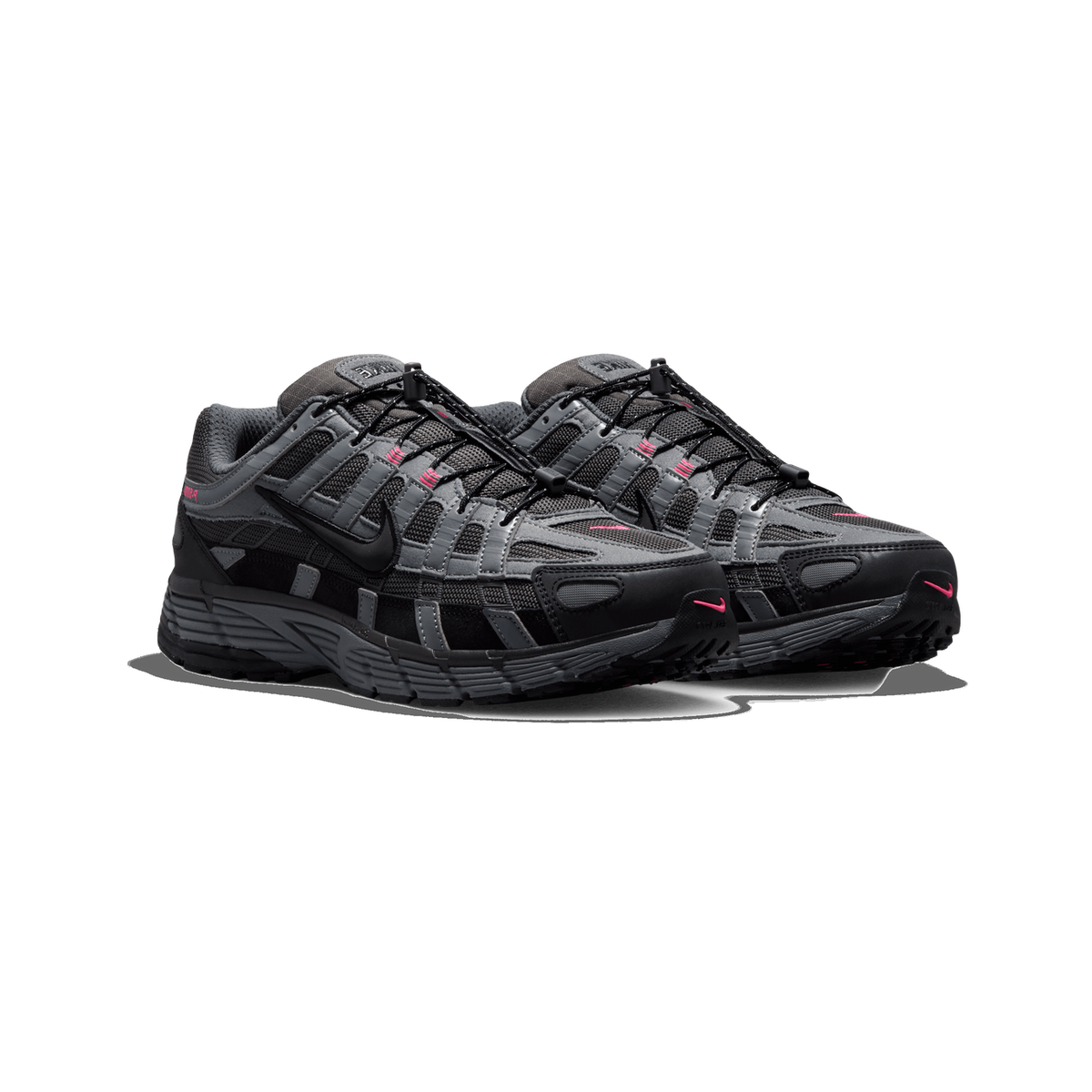 A pair of Nike P-6000 sneakers in black, dark grey, and pink, shown side by side at a three-quarter angle with the toes pointing toward the viewer's left, with bungee-style lace toggles and pink Nike swoosh accents visible.