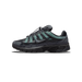 Side profile of a Nike P-6000 sneaker in anthracite grey and black with sage-green suede overlays, toe pointing left, showing the Swoosh logo, a 'P-6000' label on the heel panel, and a bungee lace-lock system.