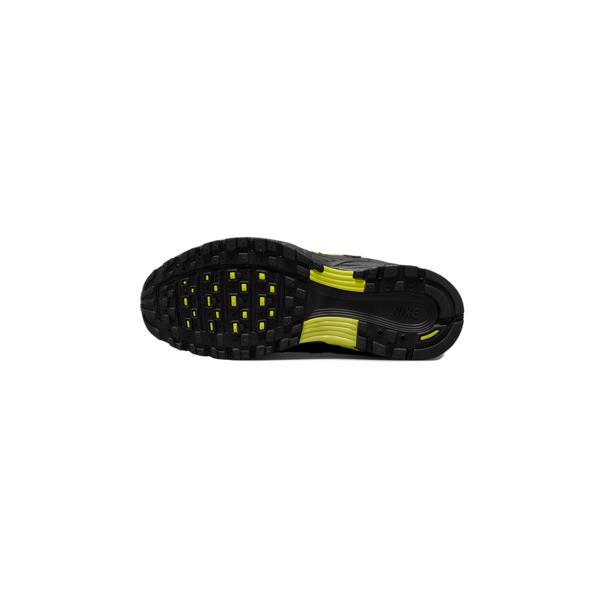 Underside of a black and grey Nike P-6000 sneaker showing the full black lug outsole with yellow accent inserts and the Nike wordmark near the heel.