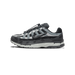 Side profile of a grey and black Nike P-6000 sneaker facing left, showing the Swoosh logo, bungee lace toggle, and light grey Rideliner midsole.