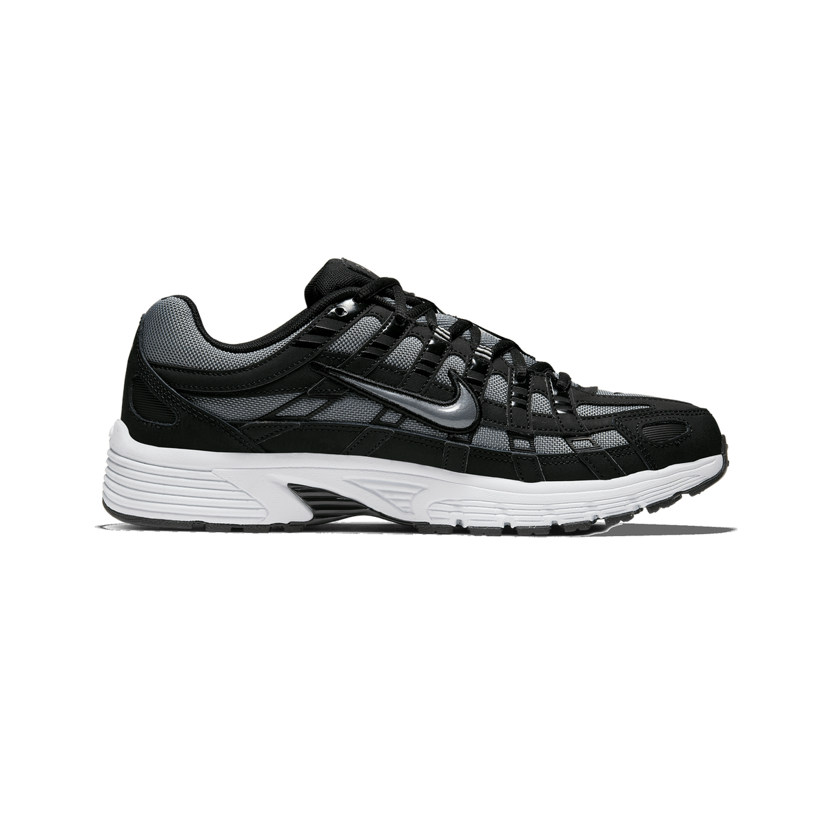 Side profile of a black and grey Nike P-6000 sneaker with a white midsole, toe pointing left, showing the Swoosh logo on the side panel.