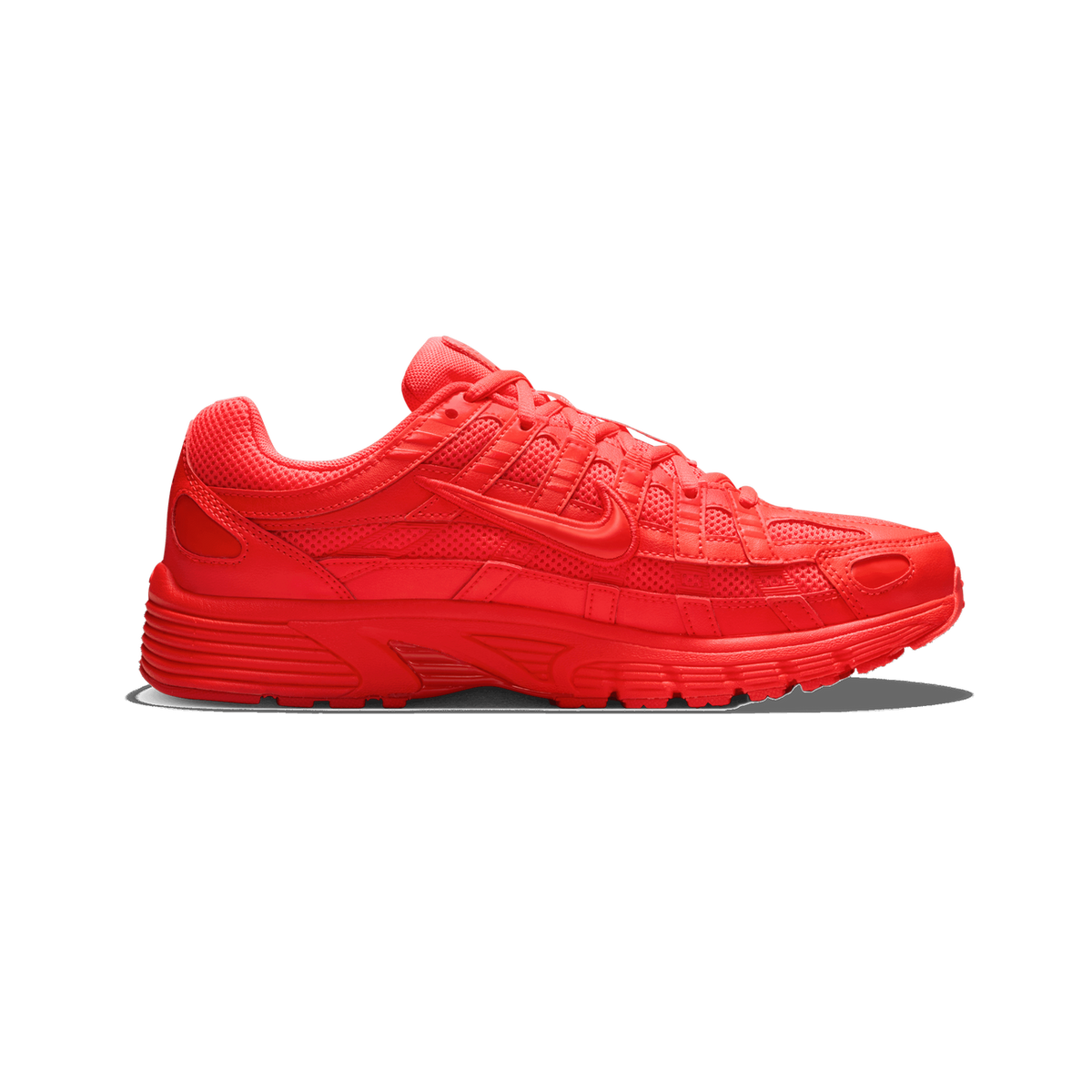 Side profile of a single bright red Nike P-6000 sneaker with the toe pointing left, showing a tonal red mesh and synthetic upper, a red Swoosh logo on the side, and a chunky red sole.